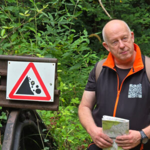 Pete next to hazard sign